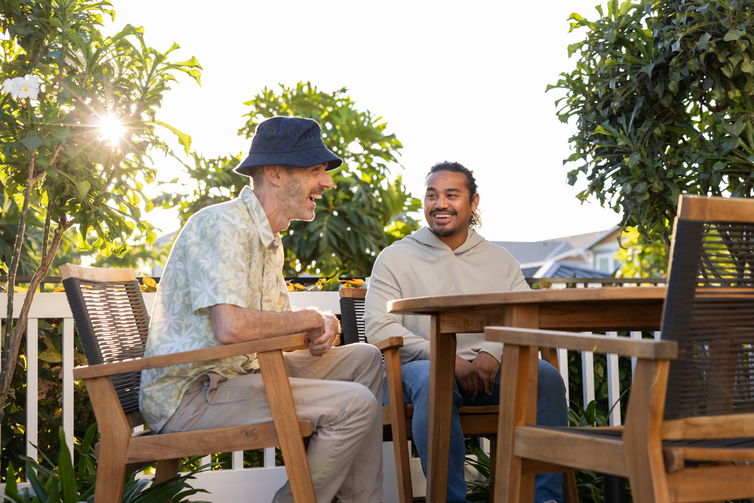 Men sitting smiling HNK_OpenWaterProductions-7894